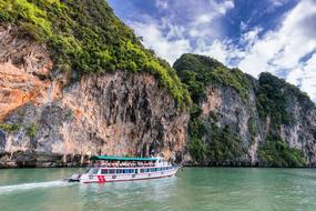 landscape of Cliff and Ocean and Boat