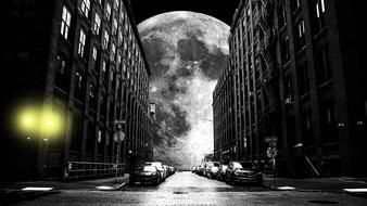 moon on a city street in a mystical black and white landscape