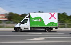 small truck on the highway in a blurred background