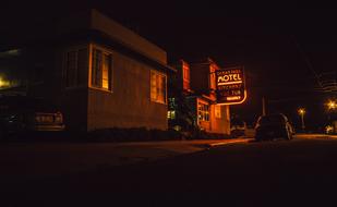 motel sign on the building at night