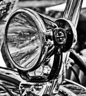 chrome shiny headlight close up