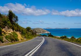 empty paved highway along the seaside