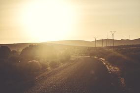 Beautiful landscape of the roadway, among the hills, in colorful sunset
