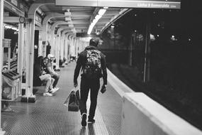 people in the subway in black and white background