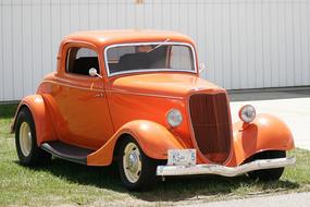 vintage orange car on a sunny day