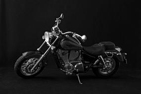 chrome black motorcycle on black background