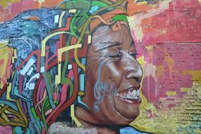 Colorful and beautiful graffities with the portrait of the woman, on the wall in Colombia, South America