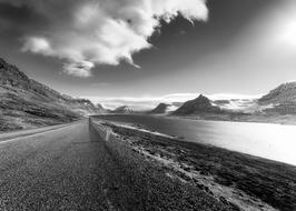 Black and white, beautiful landscape of the road, in the Fjord with the river in Iceland