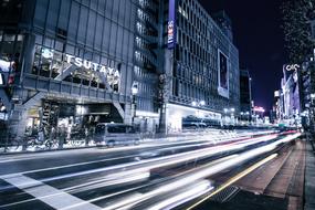 Beautiful, city with the cars in movement and colorful lights at night