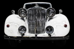 front view of old white Car