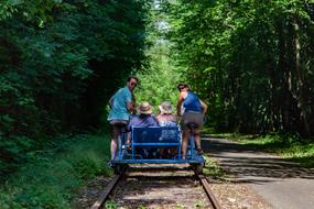 photo of people on a rail bike