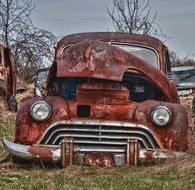 Old Car Rusted on the grass