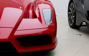 Beautiful, shiny, red Ferrari Enzo car with headlight