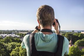 a photographer takes a panoramic photo of Tallinn, estonia