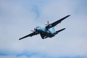 photo of a military aircraft in the sky against the background of clouds