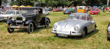 luxury retro cars on display outdoors