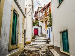 buildings on a narrow street on Skopelos island, Greece