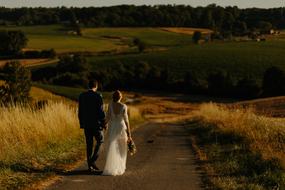 Couple, walking on the beautiful and colorful road, with the plants, in the Highland