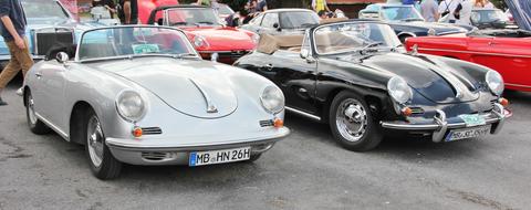 Beautiful and colorful, retro, shiny cars on the asphalt