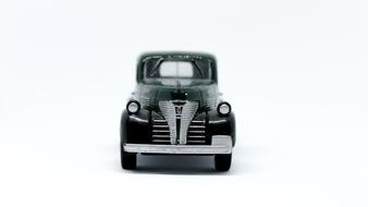 Beautiful, retro, black and silver car at white background