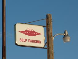 ufo self parking, traffic sign on pole at sky, usa, nevada, rachel