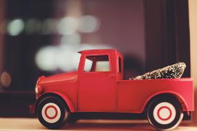 red toy truck with christmas tree