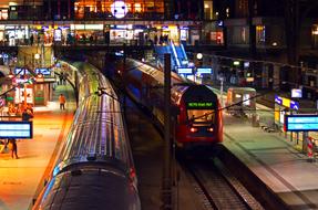 trains at the railway station in hamburg at night