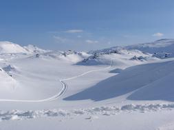 Beautiful landscape of the snowy valley between the mountains