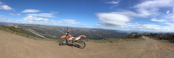 Colorful bike, on the beautiful mountains of Victoria, Australia, under the blue sky with clouds