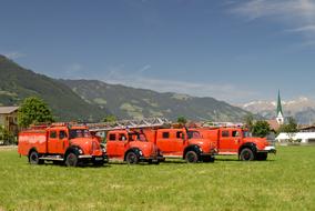 red retro magirus fire trucks with turntable ladder