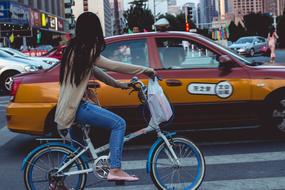 Girl bike and Taxi