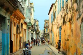 People on the beautiful and colorful street of Havana on Cuba