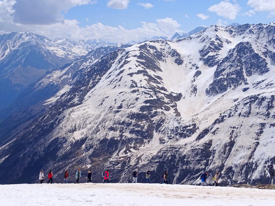 People on the beautiful snowy mountains of the Caucasus