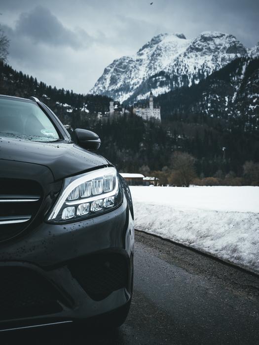 new Mercedes Benz car at scenic winter landscape, detail