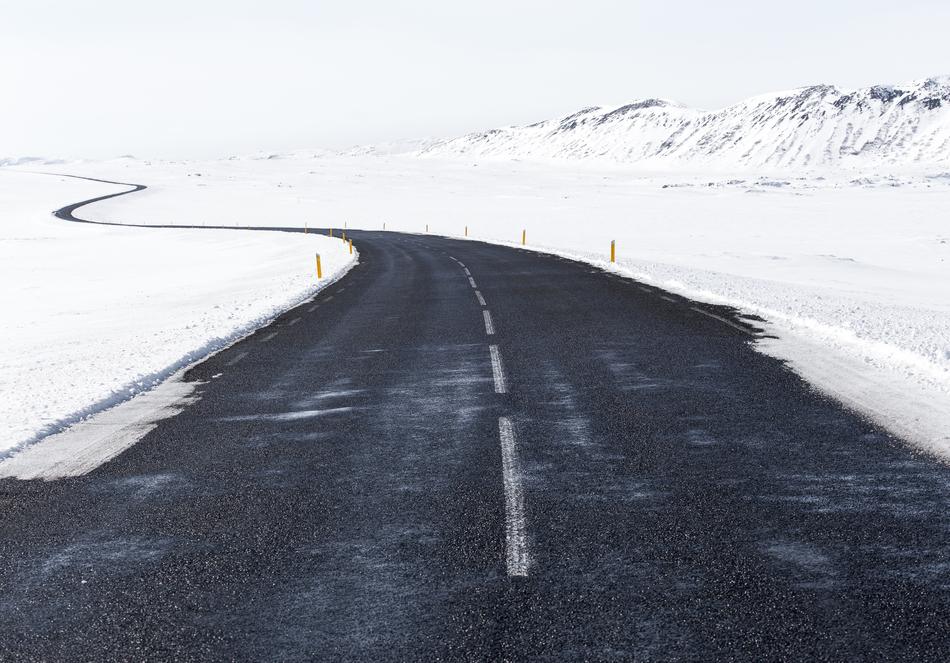 slippery highway and snowy roadside