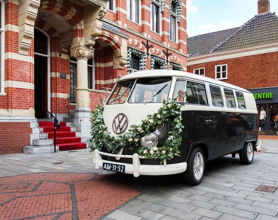the camping van is decorated with flowers