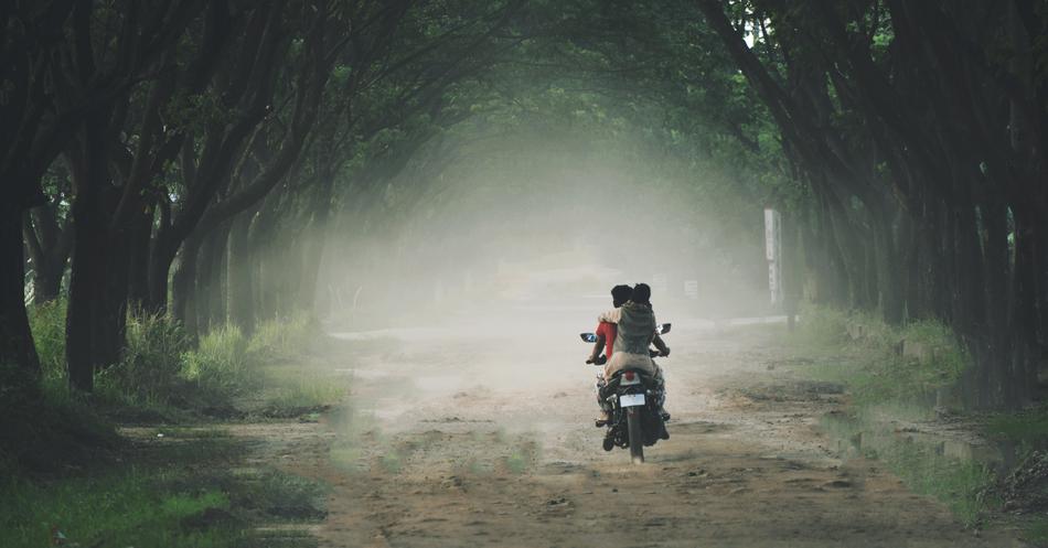 couple on the bike in fog