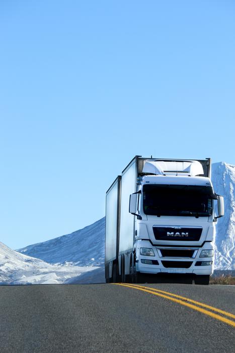white truck on the highway in winter