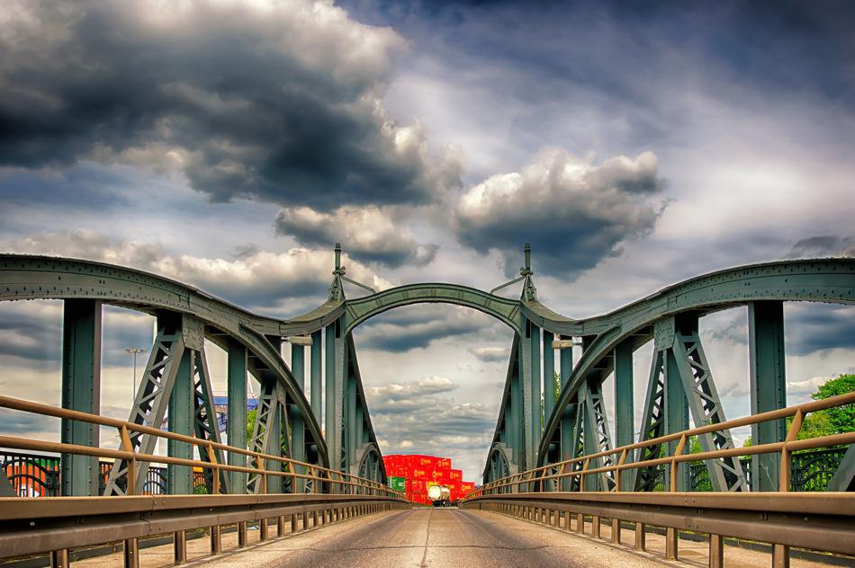 cloudy sky over the road on the bridge