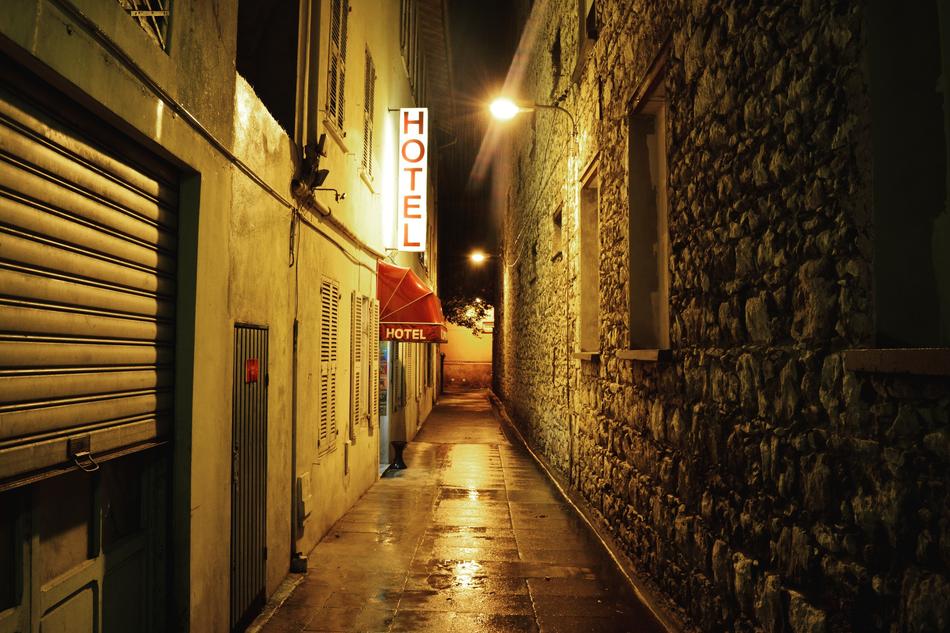 Hotel signboard in Alley at Night
