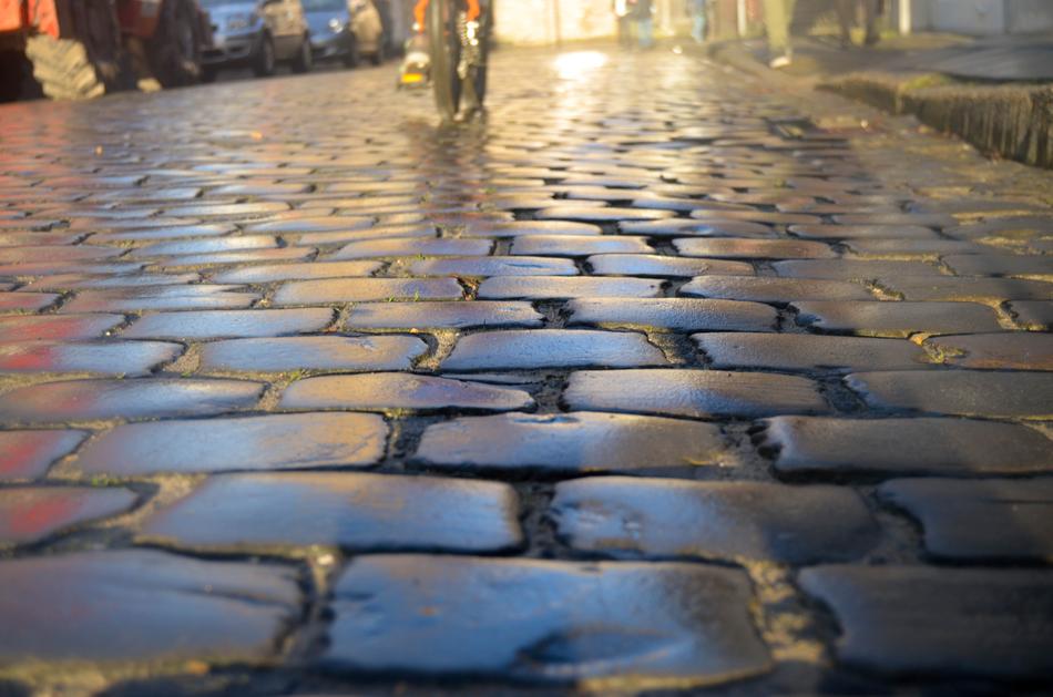 Close-up of the beautiful sidewalk with pavement, in light, in Brugge, Belgium