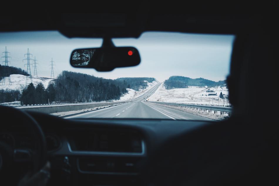 view from the car to the road in winter