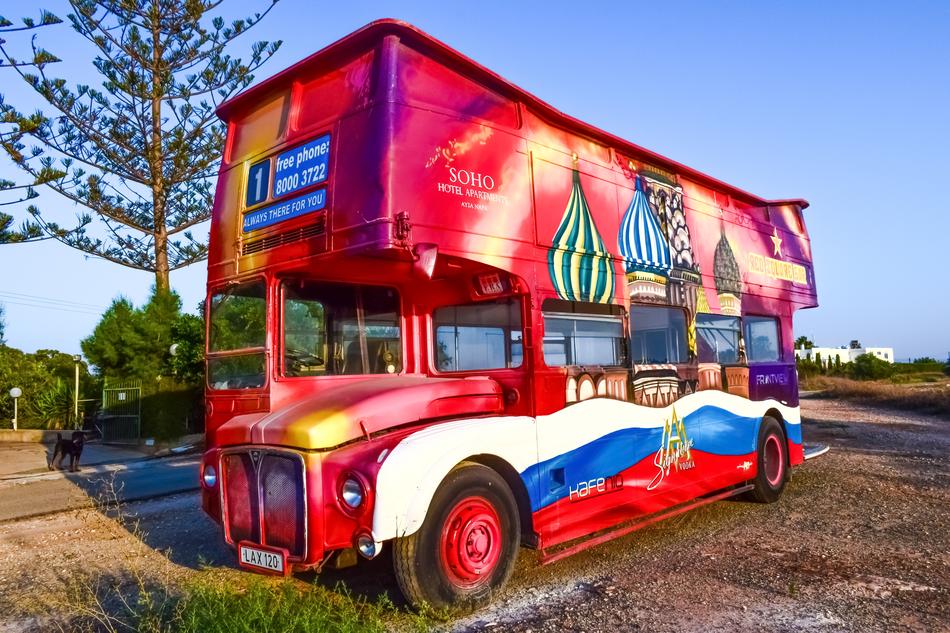 red double-decker bus with the flag of Russia