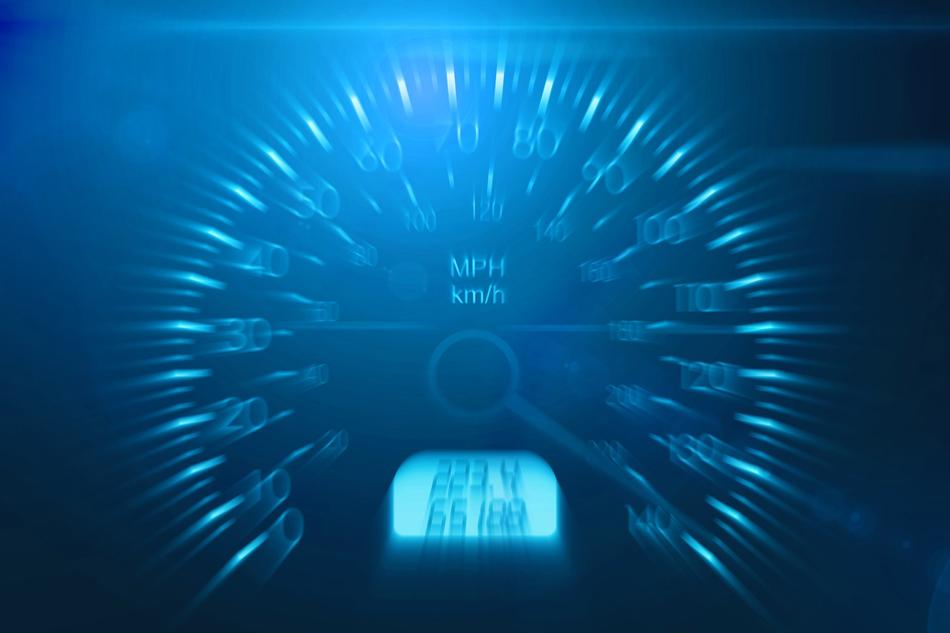 speedometer in blue blurred background