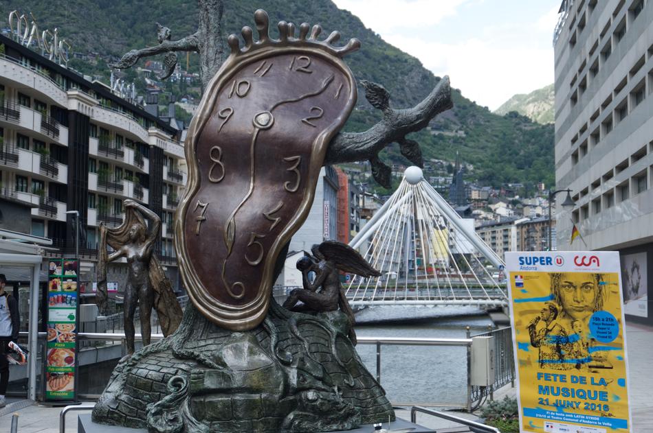 Beautiful, deformed clock statue in Andorra, among the buildings