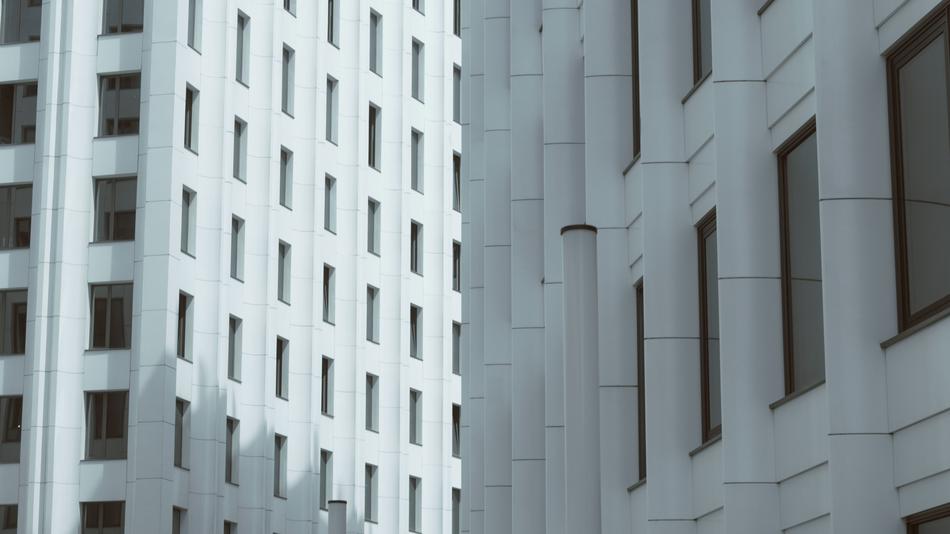 White skyscrapers in light and shadow, in the megalopolis