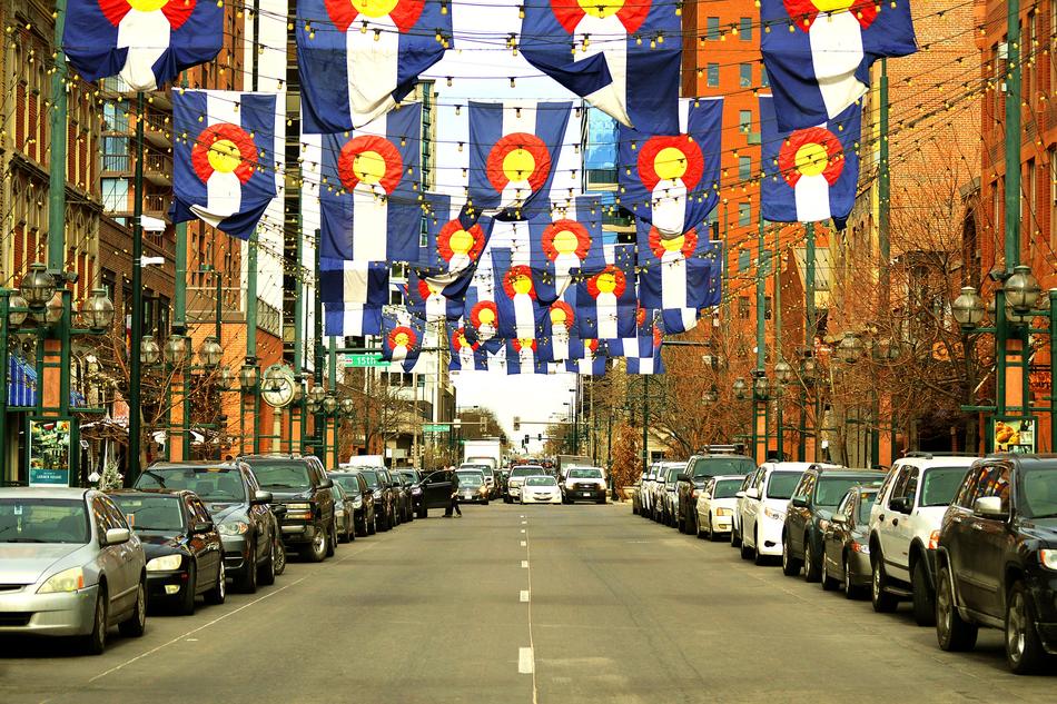 city street with colorful flags in denver