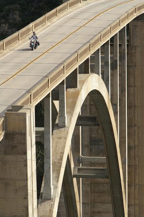 harley devinson motorcycle trip on a concrete bridge