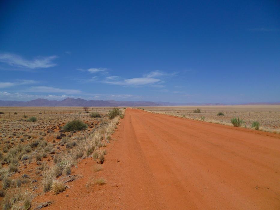 red road in the desert in Africa