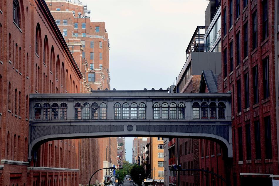 bridge between buildings above a street in new york